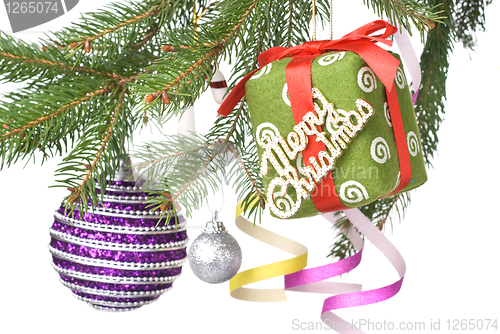 Image of Christmas balls, gift and decoration on fir tree branch isolated