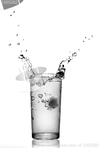 Image of water splash in glass isolated on white