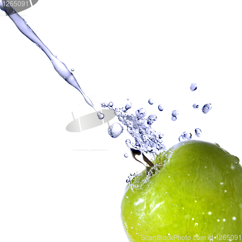 Image of fresh water splash on green apple isolated on white