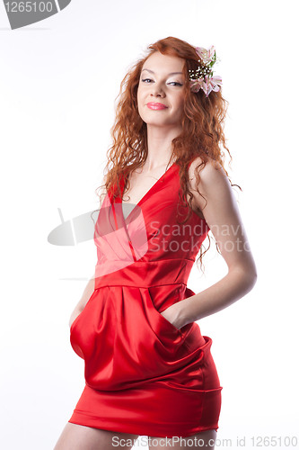 Image of Portrait of woman in red dress with spring flowers on white