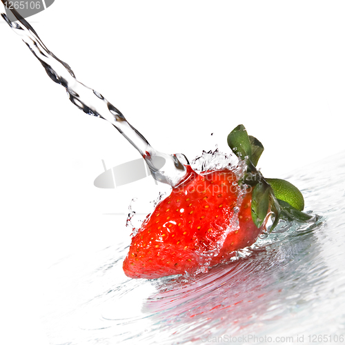 Image of Fresh strawberry and water splash isolated on white