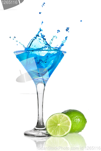 Image of Blue curacao cocktail with splash and green lime isolated on whi