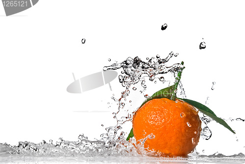 Image of Tangerine with green leaves and water splash isolated on white