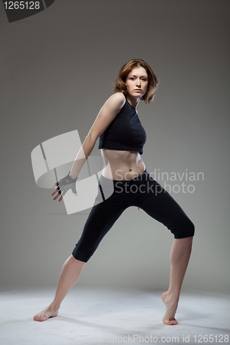 Image of attractive young woman dancing