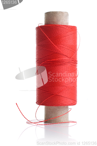 Image of red thread and coil isolated on white
