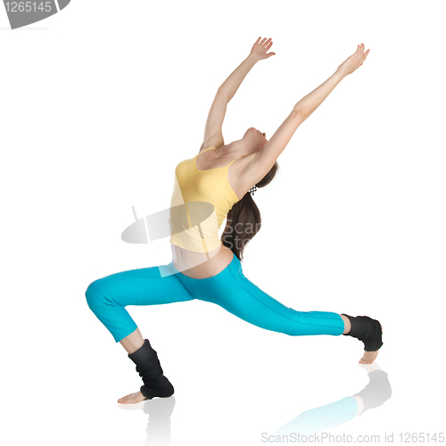 Image of attractive woman doing gymnastics on white background