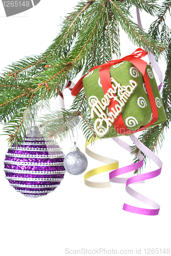 Image of Christmas balls, gift and decoration on fir tree branch isolated