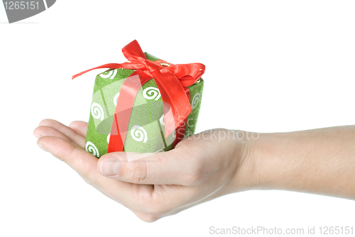 Image of Hand holding gift isolated on white