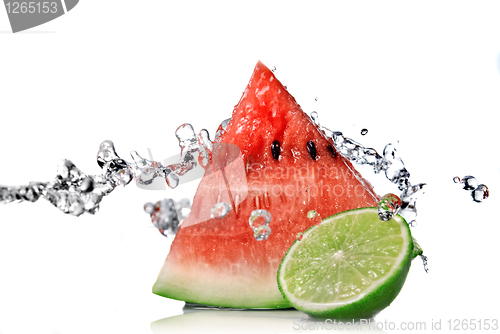 Image of watermelon, lime and water splash isolated on white