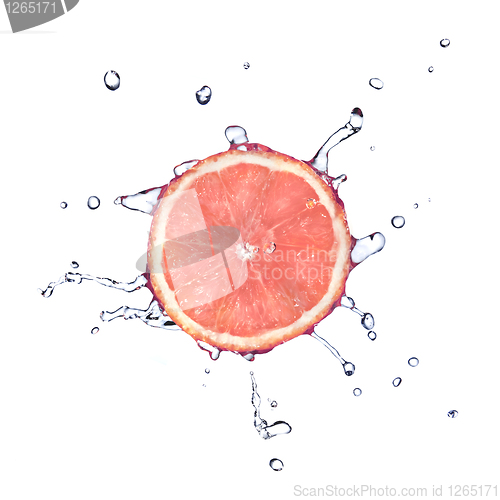 Image of Slice of grapefruit with water drops isolated on white