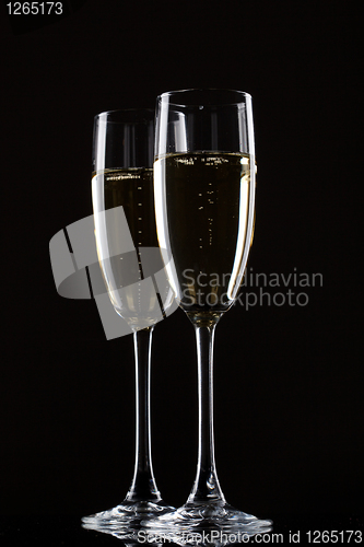 Image of Champagne in glass isolated on a black background