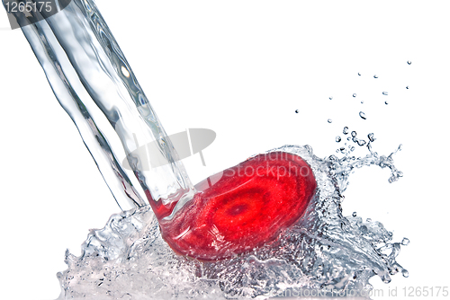 Image of red beet with water splash isolated on white