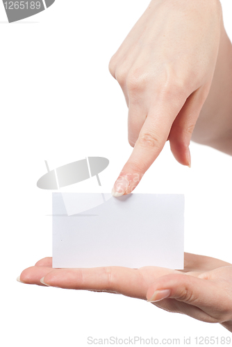 Image of Womans hands holding and pointing empty visiting card isolated o