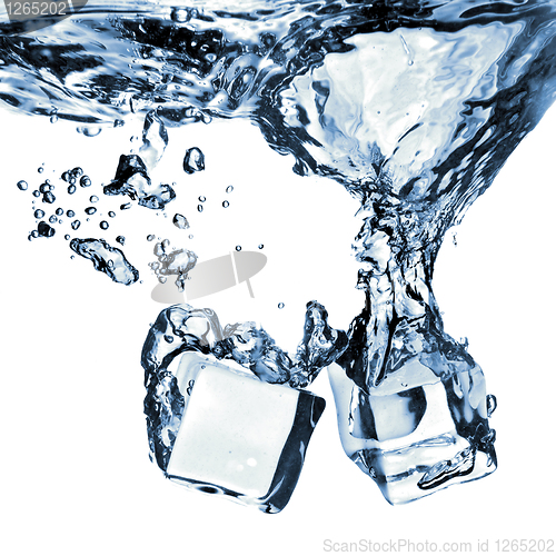 Image of ice cubes dropped into water with splash isolated on white