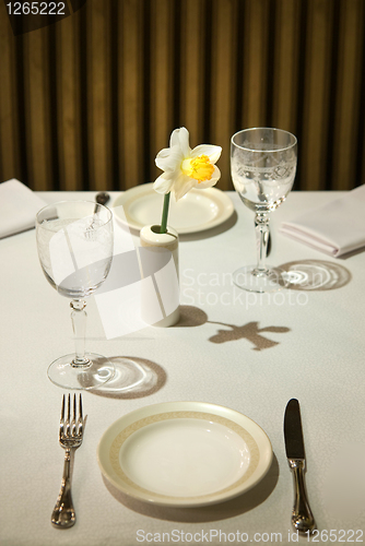 Image of served table in restaurant with flower