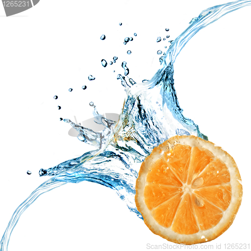 Image of Fresh orange dropped into water with splash isolated on white
