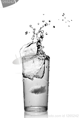 Image of water splash in glass isolated on white