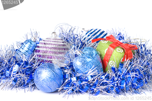 Image of christmas balls with and gift with decoration isolated on white