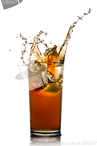 Image of Beautiful splash of cola in glass isolated on white