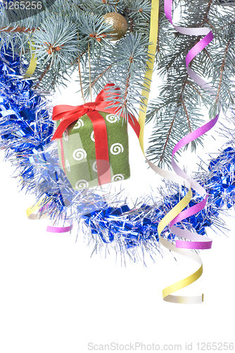 Image of Christmas gift and decoration on fir tree branch isolated on whi
