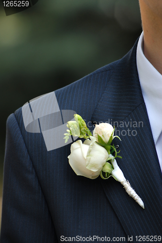 Image of wedding buttonhole with rose on mans suite