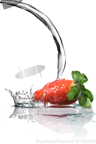 Image of Fresh strawberry and water splash isolated on white