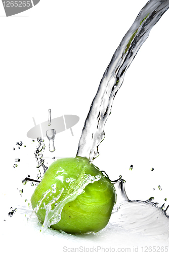 Image of fresh water splash on green apple isolated on white