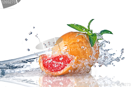 Image of Water splash on grapefruit with mint isolated on white