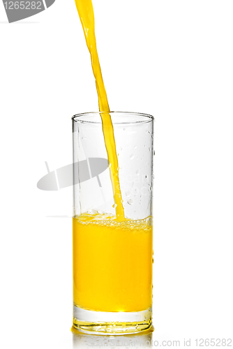 Image of orange juice poring into glass isolated on white