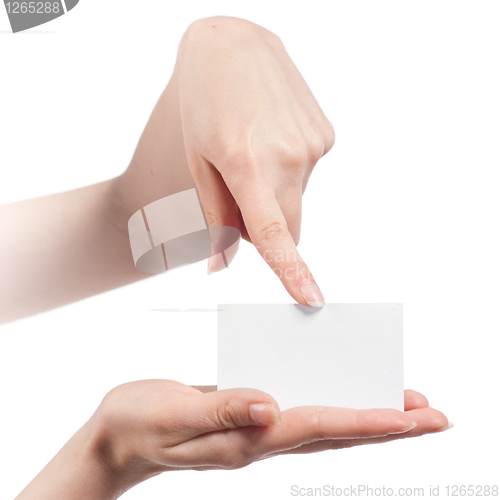 Image of Womans hands holding and pointing empty visiting card isolated o