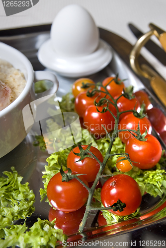 Image of Cluse up english breakfast with tomato in focus