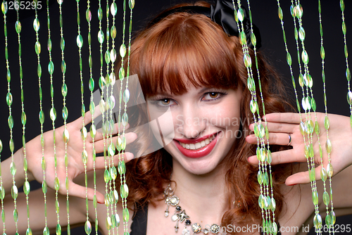 Image of beauty smiling girl with curtains