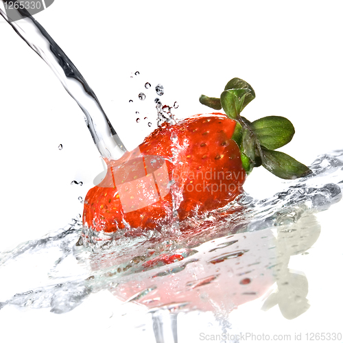 Image of Fresh strawberry and water splash isolated on white