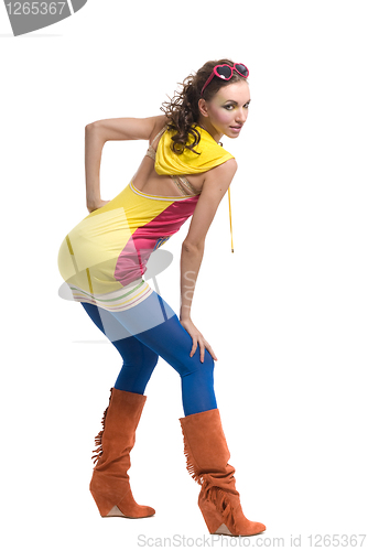 Image of Beautiful young woman in color wear on white