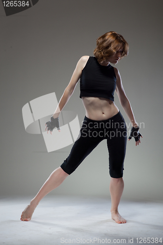 Image of attractive young woman dancing