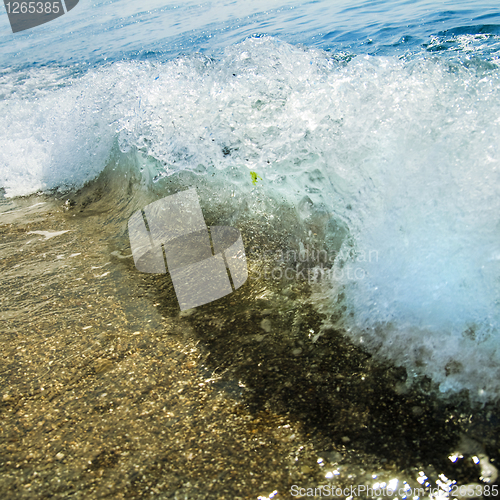 Image of sand stones and water wave