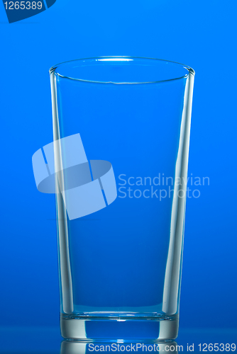 Image of Empty glass isolated on blue