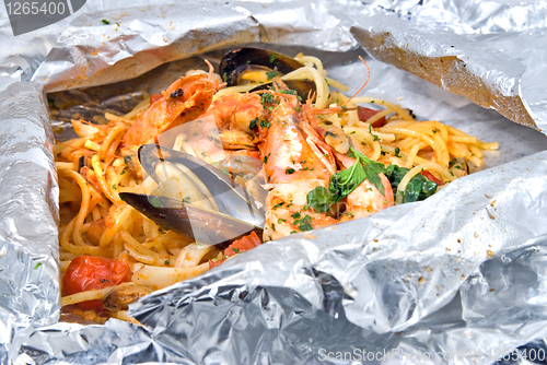 Image of pasta with oysters and tomato in foil