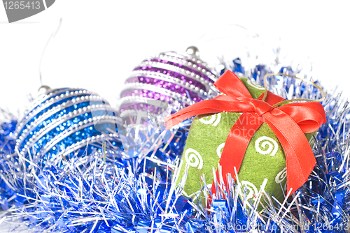 Image of christmas balls with and gift with decoration isolated on white