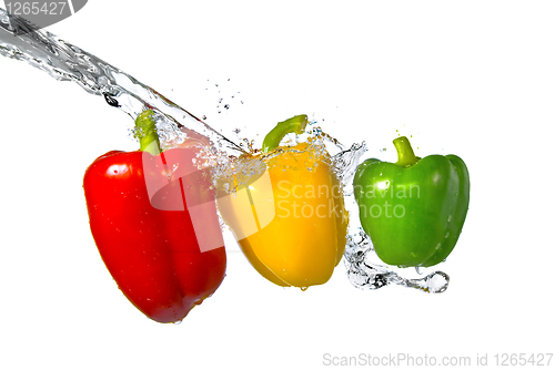 Image of red, yellow, green pepper with water splash isolated on white