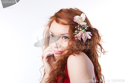 Image of Portrait of beautiful woman with spring flowers on white