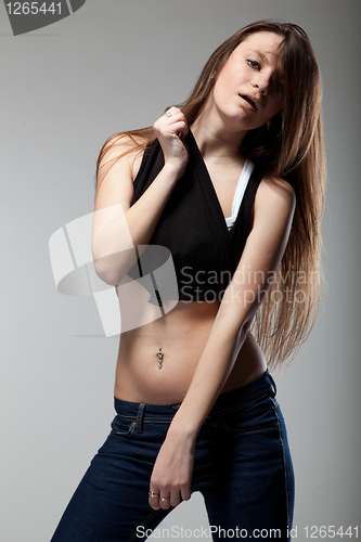 Image of attractive young woman dancing