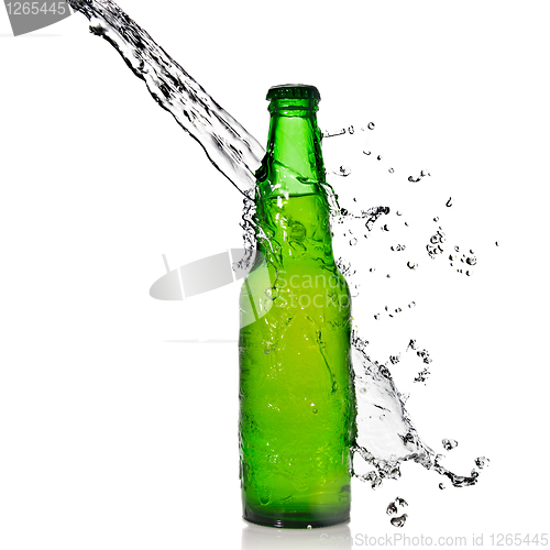 Image of Green beer bottle with water splash isolated on white
