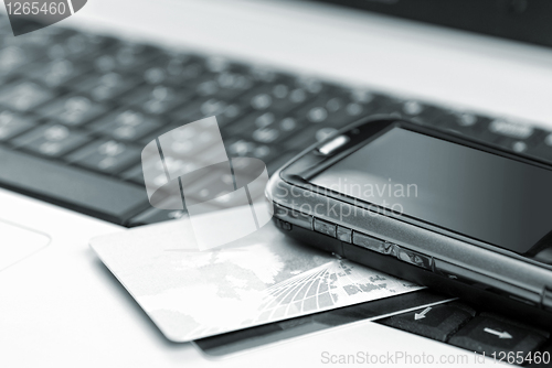 Image of Credit cards and mobile phone on the notebook