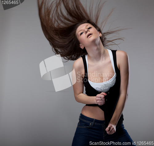 Image of attractive young woman dancing