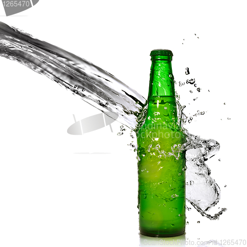 Image of Green beer bottle with water splash isolated on white