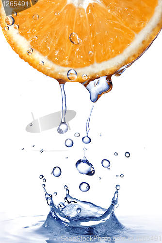 Image of fresh water drops on orange with water splash isolated on white