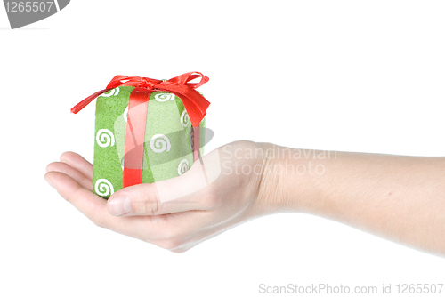 Image of Hand holding gift isolated on white