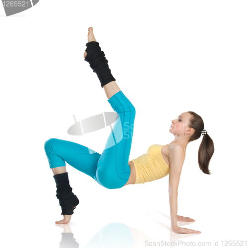 Image of attractive woman doing gymnastics on white background