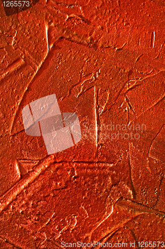 Image of texture of the red stucco wall with dabs